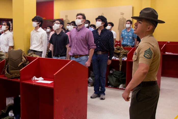 Staff Sgt. Dominic Sena, a senior drill instructor with Receiving Company, Support Battalion, instructs new recruits with Alpha Company, 3rd Recruit Training Battalion, during receiving at Marine Corps Recruit Depot, San Diego, April 6, 2021.