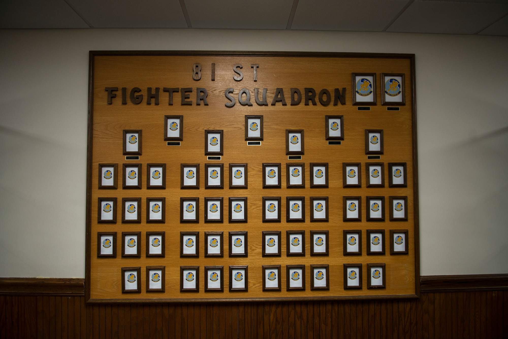 The 81st Fighter Squadron's newly hung personnel identification board is filled with place-holders until it can be filled with photos of unit members.  The 81st recently moved from Spangdahlem Air Base, Germany and will train Afghan pilots to fly the A-29 Super Tucano. The squadron has only been in their new building for a few weeks but are already conducting missions. (U.S. Air Force photo/Master Sgt. Jeffrey Allen)