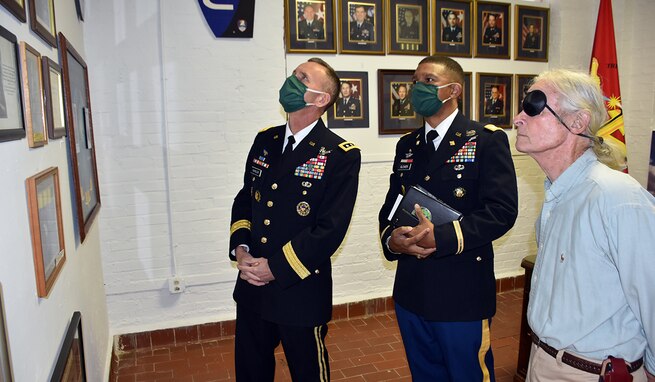 Lt. Gen. Daniel Karbler, U.S. Army Space and Missile Defense Command commanding general, and Col. Samuel Glover, USASMDC deputy chief of staff, G-8, look at the Army Space and Missile exhibit at the Fayetteville-Lincoln County Museum with Lincoln County Museum Association President Bill Stidfole, April 9 in Fayetteville, Tennessee. (U.S. Army photo by Lira B. Frye)