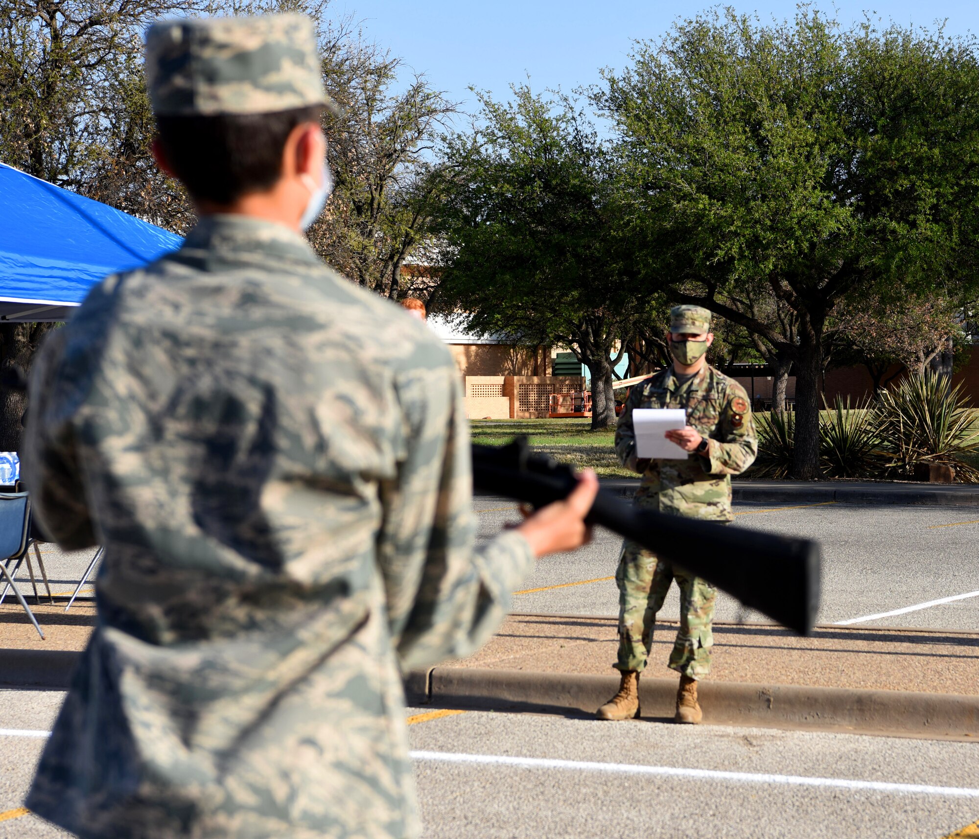 U.S. Air Force Tech. Sgt. Phillip Whitley, 315th Training Squadron Geospatial Intelligence Analysis course instructor, voluntarily grades the armed drill technique of a participant in the Air Force ROTC Detachment 847’s Annual Drill Meet, at Angelo State University in San Angelo, Texas, April 10, 2021. Whitley’s volunteerism demonstrated the Whole Airmen Concept through his dedication to help the local community and inspire the future force. (U.S. Air Force photo by Senior Airman Abbey Rieves)