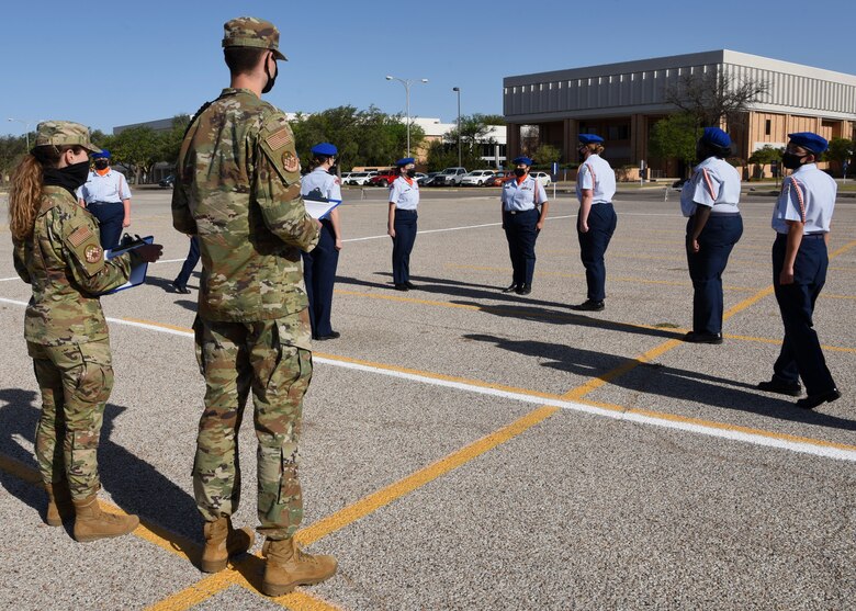 U.S. Air Force students from the 315th Training Squadron voluntarily judge a performance at the Air Force ROTC Detachment 847’s Annual Drill Meet, at Angelo State University in San Angelo, Texas, April 10, 2021. Five high schools from across Texas participated in the competition and networked with Team Goodfellow following the events. (U.S. Air Force photo by Senior Airman Abbey Rieves)