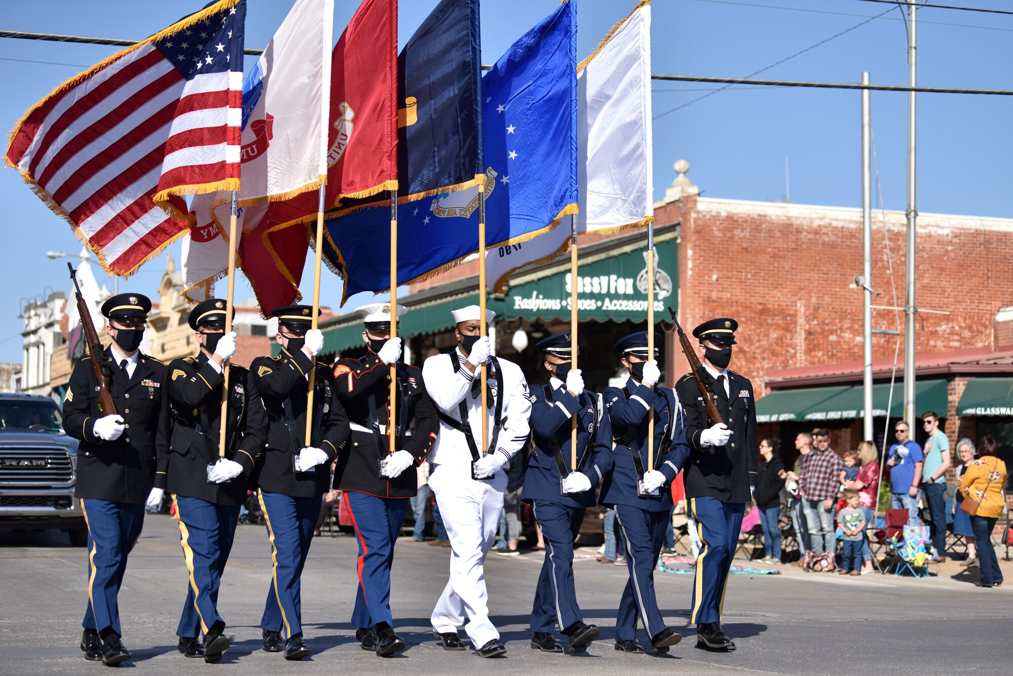 Goodfellow Joint Service Color Guard members lead the 89th Annual San Angelo Rodeo parade through downtown San Angelo, April 10, 2021. The parade marked the beginning of the 89th Annual San Angelo Stock Show and Rodeo. (U.S. Air Force photo by Staff Sgt. Seraiah Wolf)