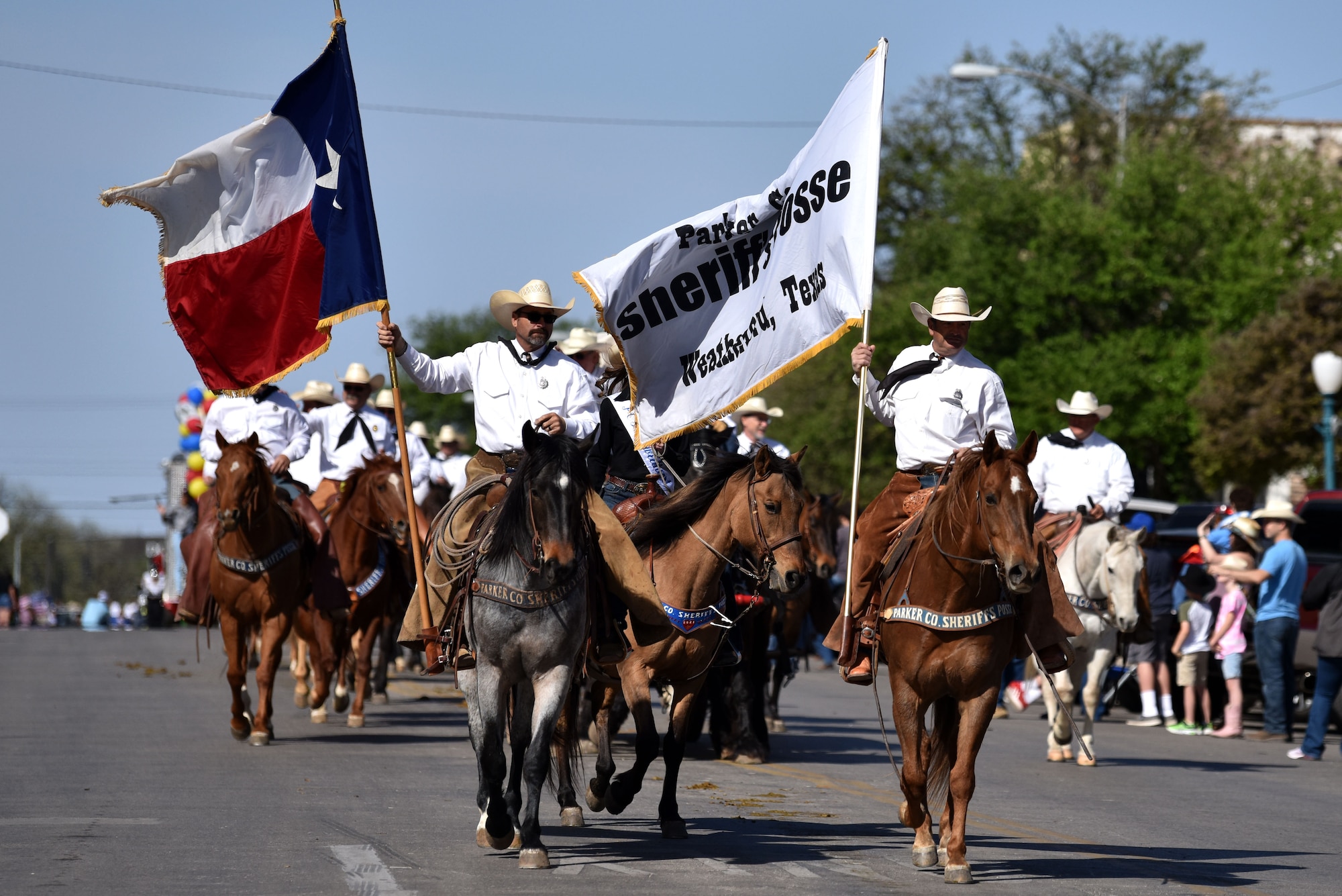 The Parker County Sheriff’s Posse rides during the 89th Annual San Angelo Rodeo parade through downtown San Angelo April 10, 2021. The posse has ridden in many parades and won multiple awards over the years. (U.S. Air Force photo by Staff Sgt. Seraiah Wolf)