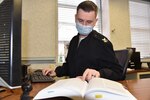 210203-N-N0443-1753 NORFOLK, Va. (Feb. 3, 2021) Legalman 1st Class Kevin Billings, assigned to Region Legal Service Office Mid-Atlantic, works at his desk Feb. 3, 2021. Billings created the Next Generation Study Planner, a customizable study plan for advancement exams now available on Navy COOL and MyNavy Portal. Billings started the planner three years ago when he realized that Sailors would benefit if they had assistance in creating study plans ahead of advancement exam administrations. (U.S. Navy photo by Lt. Carolina Gray)