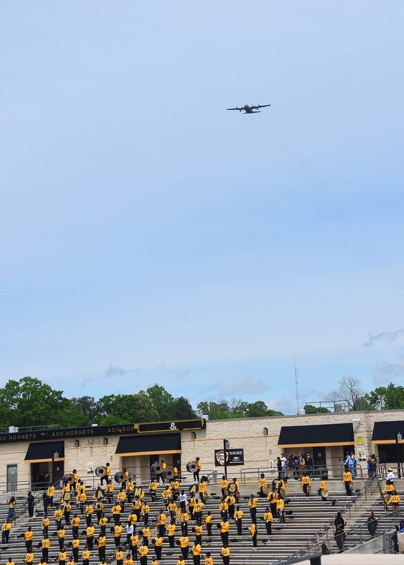 C-130 flies over stadium