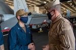 210411-N-AY174-1086 DUQM (April 11, 2021) - Vice Adm. Samuel Paparo, commander of U.S. Naval Forces Central Command (NAVCENT), U.S. 5th Fleet and Combined Maritime Forces speaks with Sailors aboard aircraft carrier USS Dwight D. Eisenhower (CVN 69) during a sustainment and logistics visit in Duqm, Oman, April 11. The Eisenhower Carrier Strike Group is deployed to the U.S. 5th Fleet area of operations in support of naval operations to ensure maritime stability and security in the Central Region, connecting the Mediterranean and Paciﬁc through the western Indian Ocean and three strategic choke points. (U.S. Navy photo by Mass Communication Specialist 3rd Class Brianna T. Thompson-Lee)