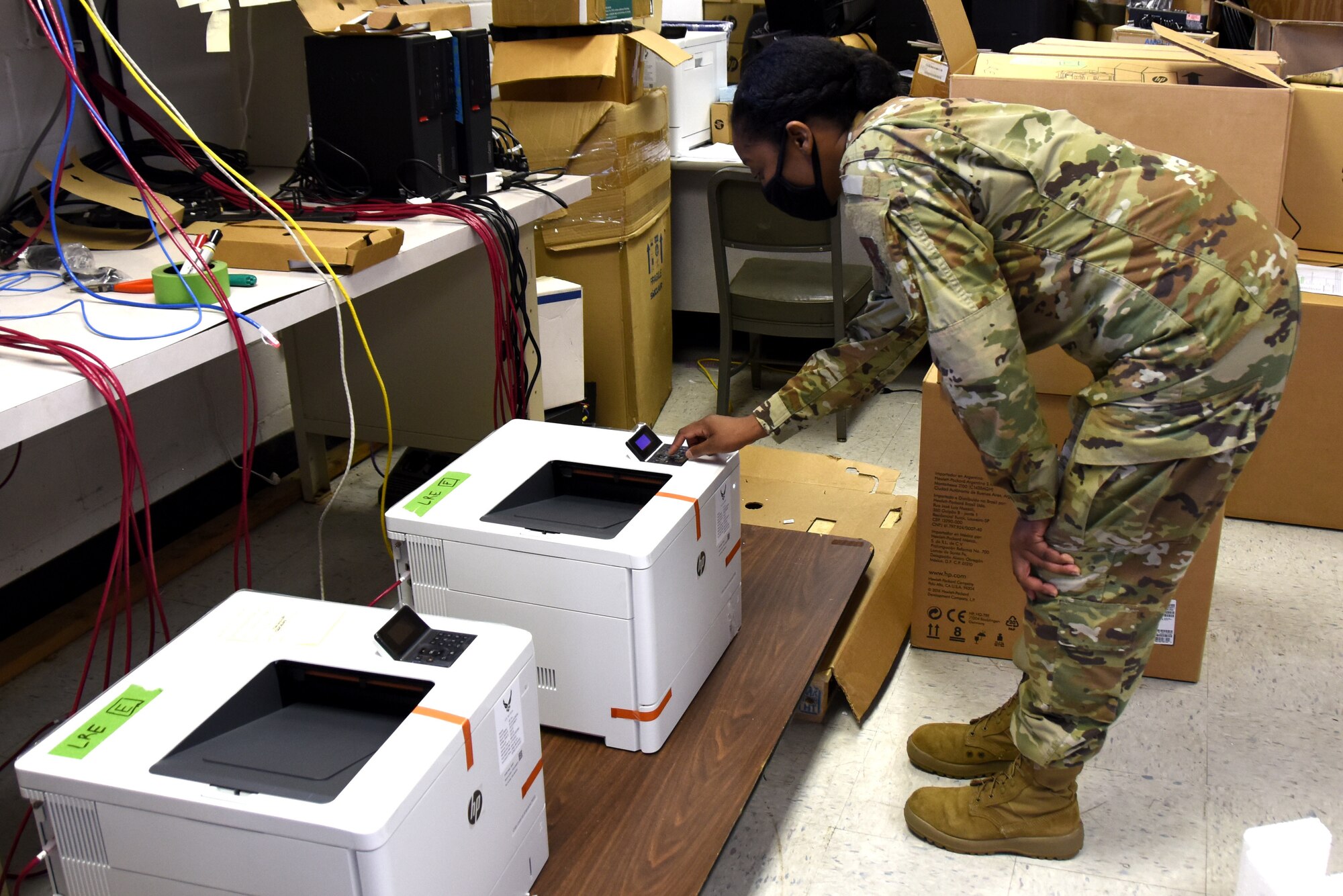 U.S. Air Force Staff Sgt. Tiffany Greene, 145th Communications Flight, obtains an IP address and re-images a printer at the North Carolina Air National Guard Base, Charlotte Douglas International Airport, April 11, 2021