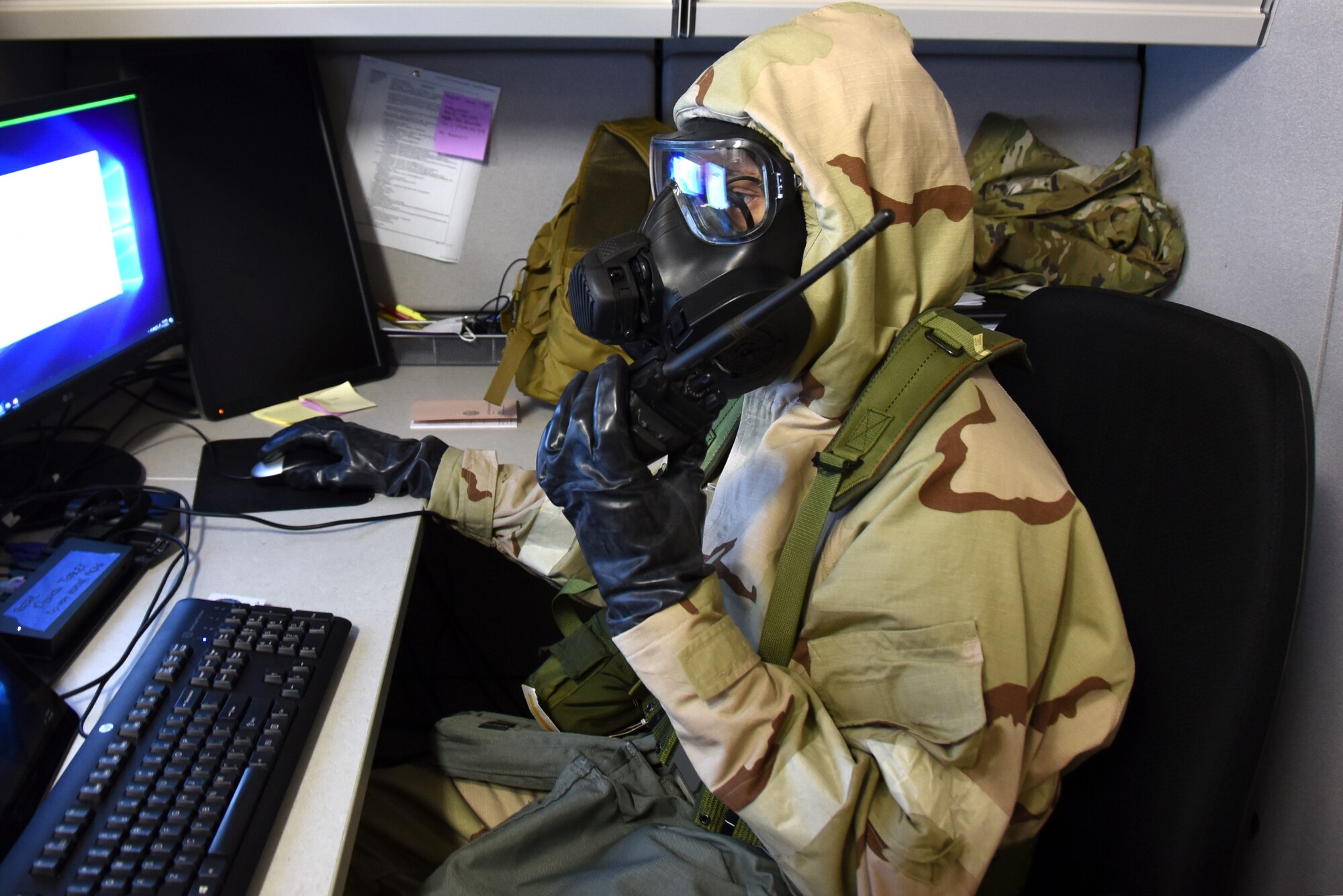 U.S. Air Force Staff Sgt. Rashad Rizer, 145th Communications Flight client system technician, responds to an Emergency Operations Center accountability request during practice for a large-scale readiness exercise at the North Carolina Air National Guard Base.