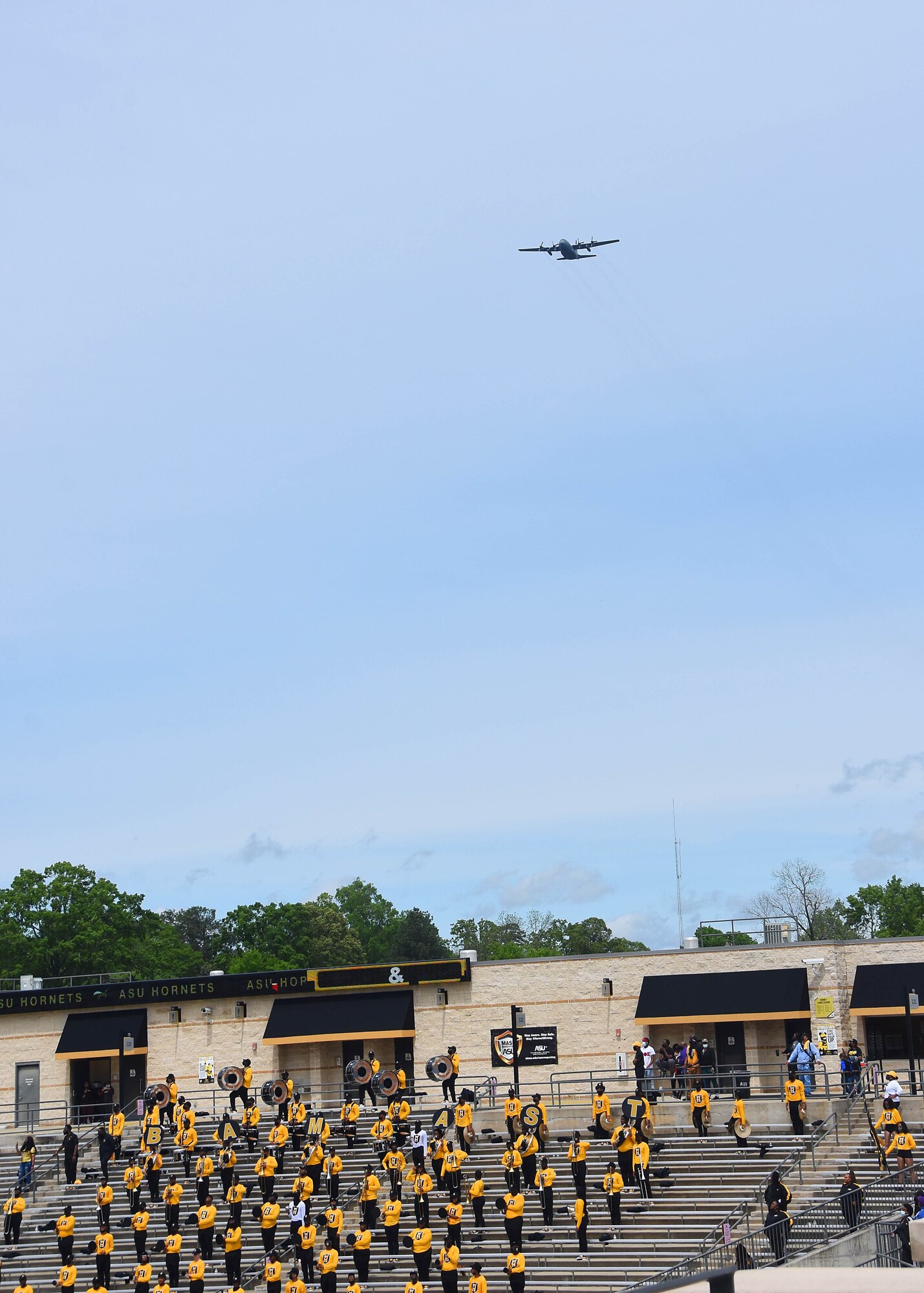 C-130 flies over stadium