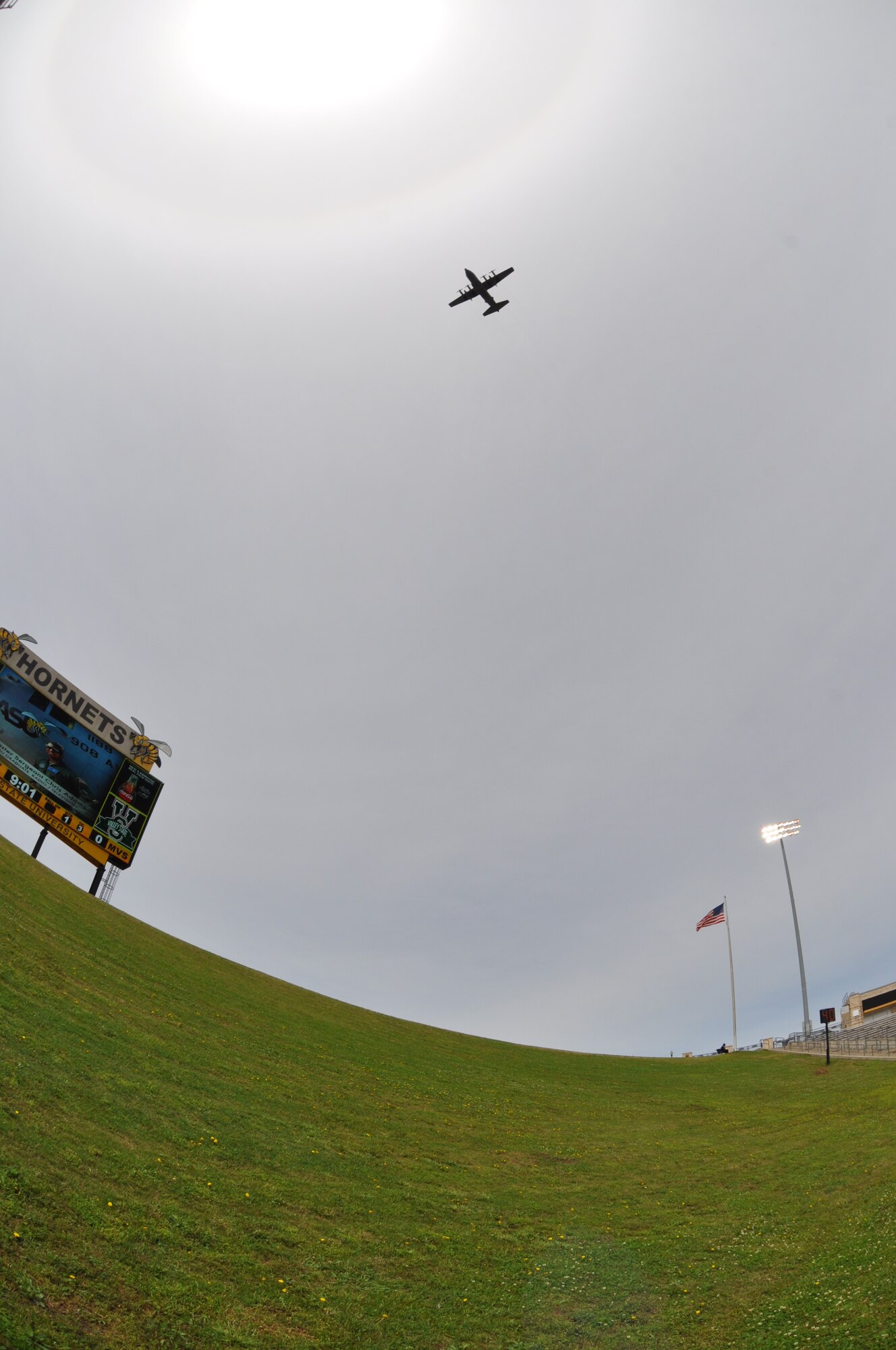 C-130 flies over stadium