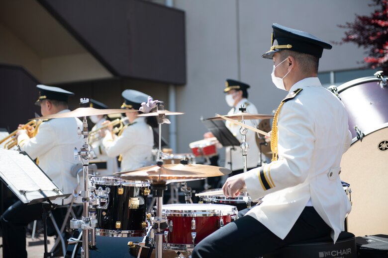 A Japanese National Police Band drummer plays a song during a concert at the Yokota Community Center on Yokota Air Base, Japan, April 11, 2021. The JNP held the concert as part of an event to help educate individuals on traffic safety. (U.S. Air Force photo by Staff Sgt. Joshua Edwards)