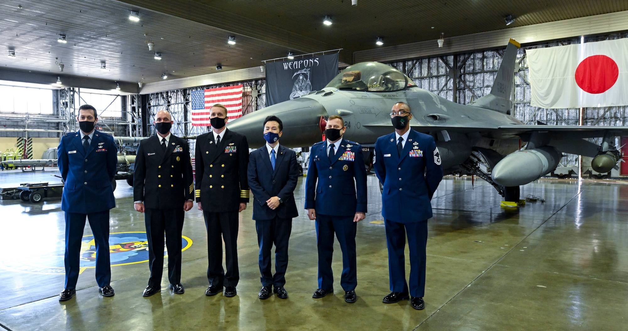 Takashi Uto, Japan State Minister of Foreign Affairs, poses for a photo with Misawa Air Base leaders during his visit to Misawa Air Base, Japan, April 12, 2021. Uto visited the base to meet with U.S. and Japanese military leaders to learn about the mission and challenges of the bilateral and joint base. (U.S. Air Force photo by Tech. Sgt. Timothy Moore)