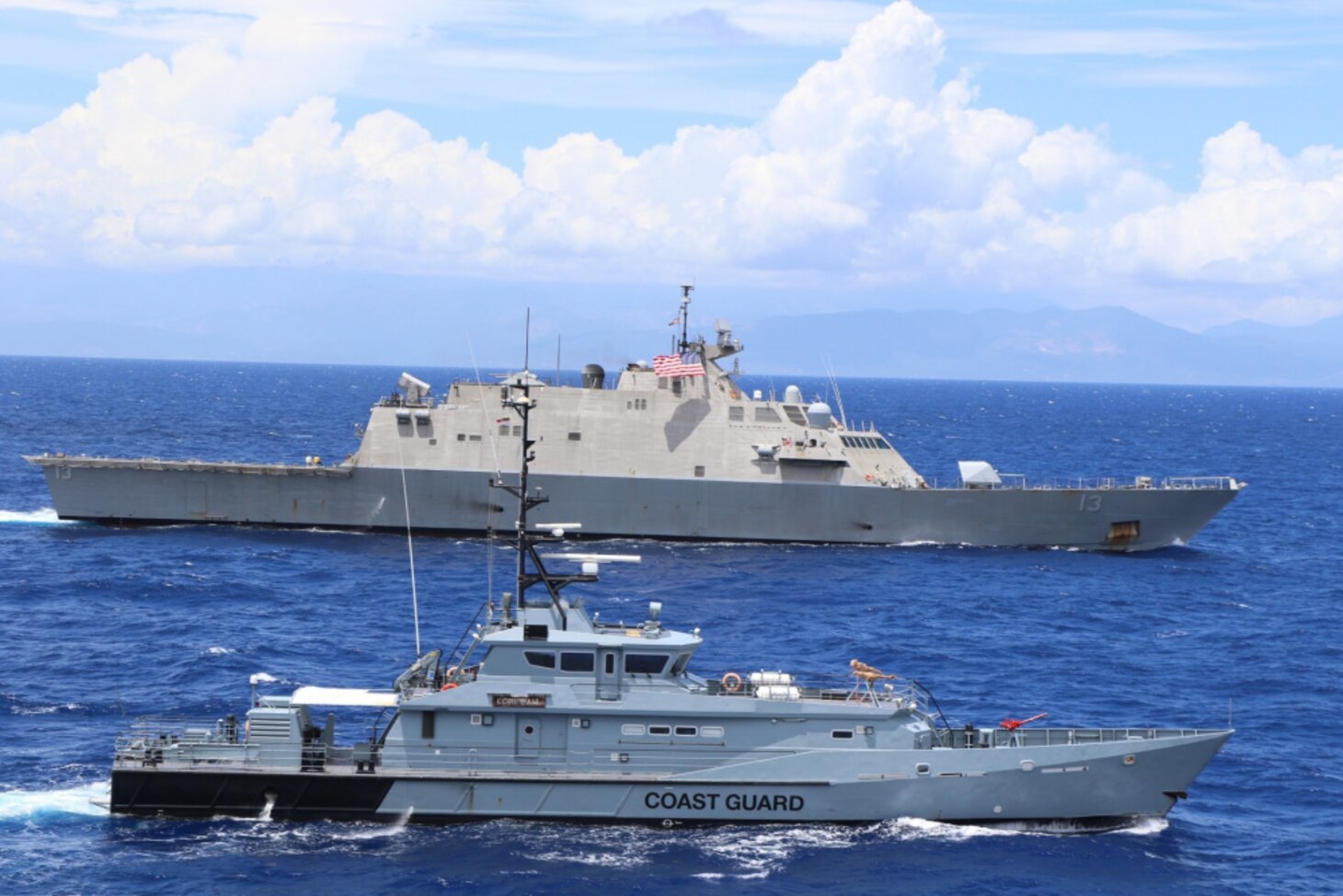 USS Wichita (LCS 13) and Jamaica Defence Force Coast Guard patrol vessel HMJS Cornwall sail in formation during a live-fire exercise.