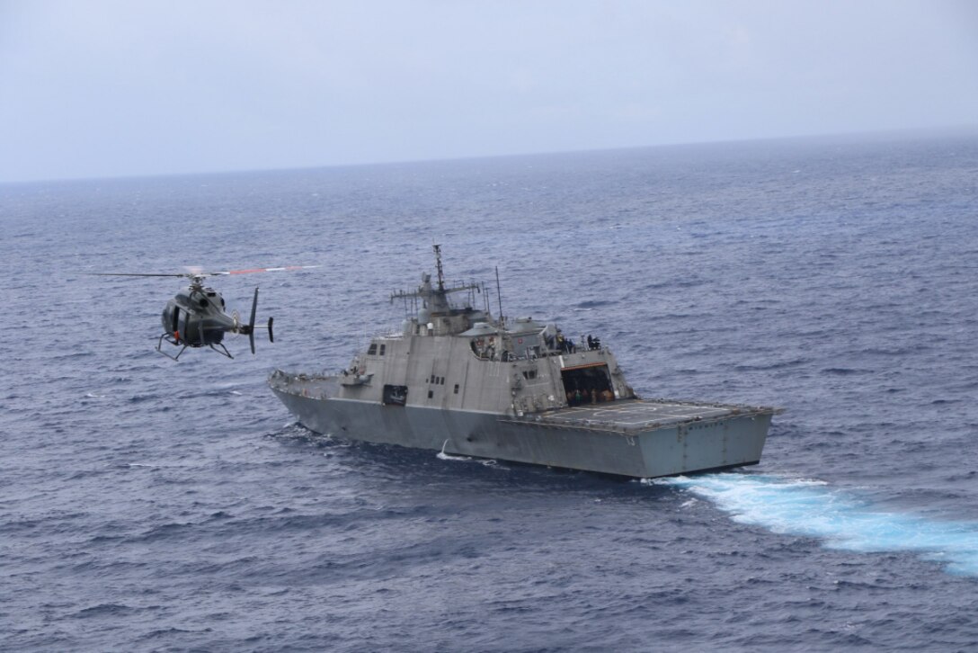 USS Wichita (LCS 13) and Jamaica Defence Force Coast Guard patrol vessel HMJS Cornwall sail in formation during a live-fire exercise.