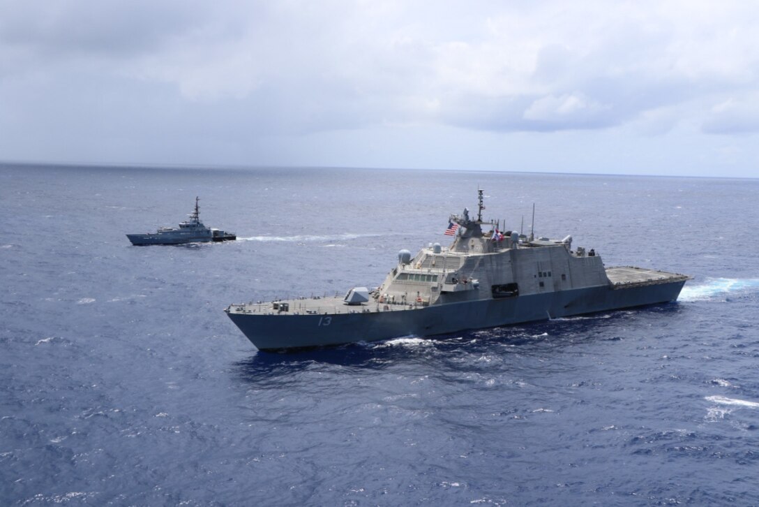 USS Wichita (LCS 13) and Jamaica Defence Force Coast Guard patrol vessel HMJS Cornwall sail in formation during a live-fire exercise.