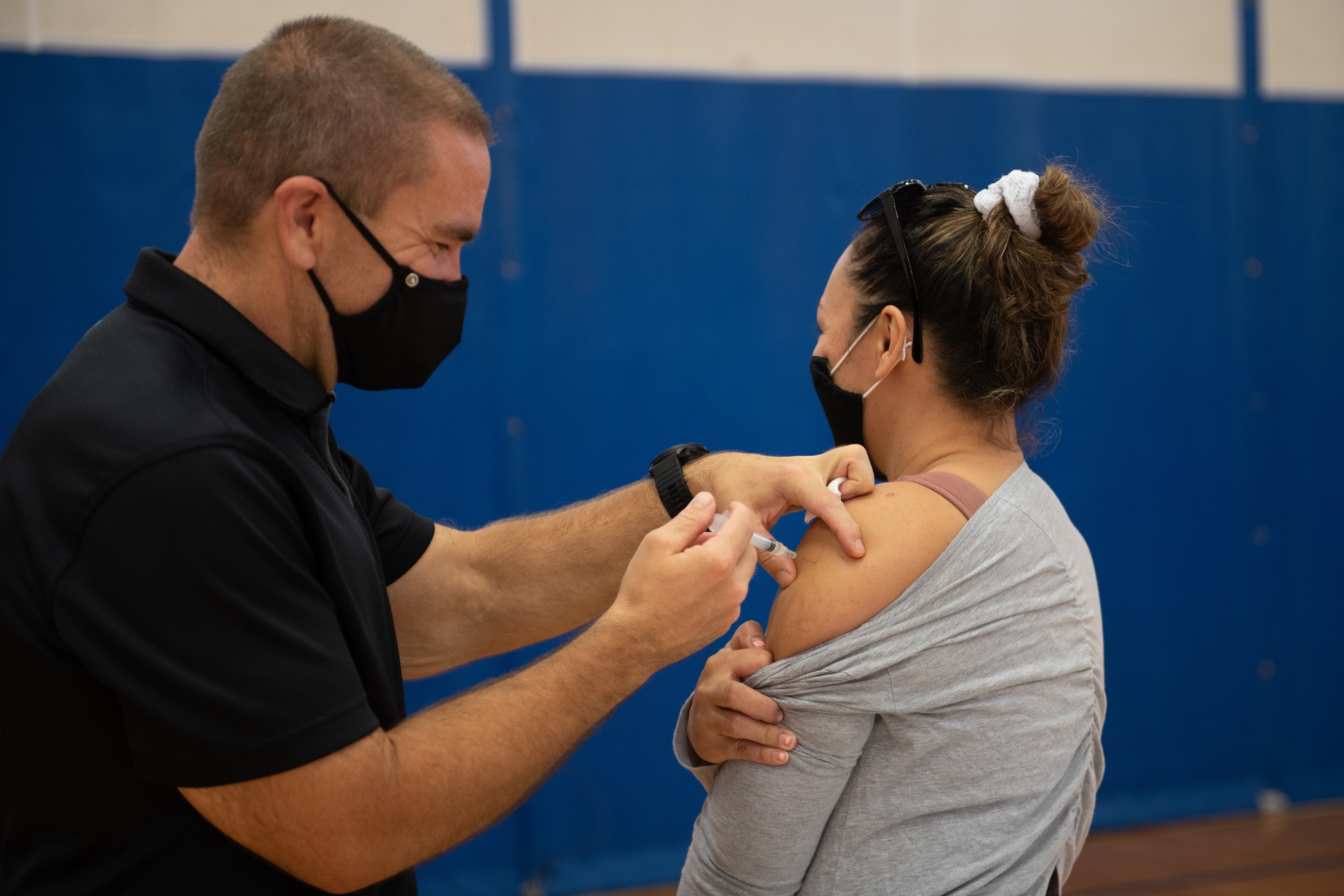 Johnson & Johnson COVID-19 vaccine is administered to a Team Kadena member.