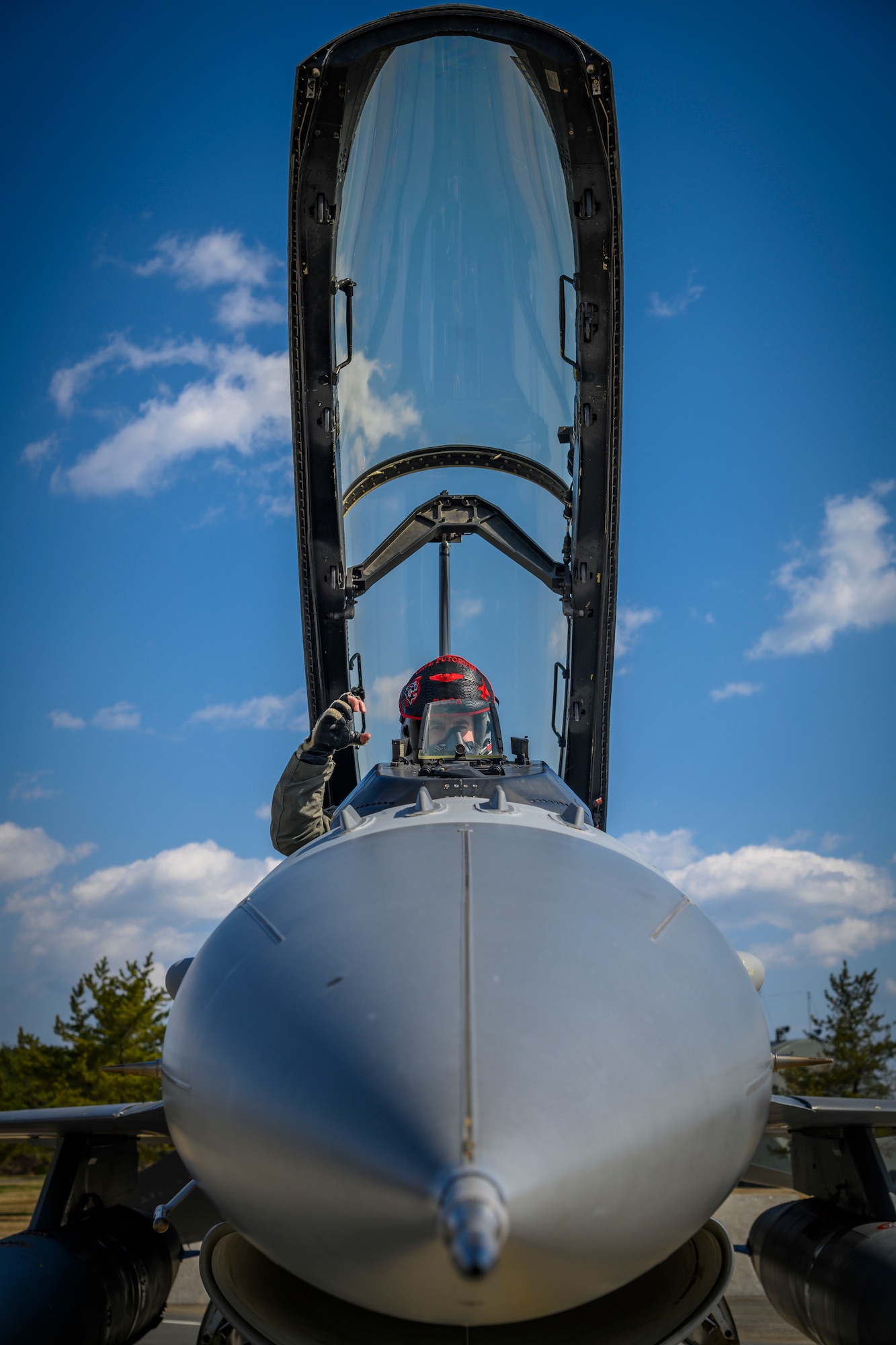 U.S. Air Force Capt. Spencer “Boca” Rhoton, a 13th Fighter Squadron F-16 Fighting Falcon pilot, holds up the 13th FS call sign “Cave Putorium” (CP) at Misawa Air Base, Japan, April 7, 2021. Rhoton attended the mission planning cells on the six-jet Agile Combat Employment-style deployment to Chitose during 5th Air Force’s Exercise PACIFIC RONIN, ensuring all parties understood both USAF and JASDF tactics in order to integrate seamlessly into a unified fighting force. (U.S. Air Force photo by Airman 1st Class China M. Shock)