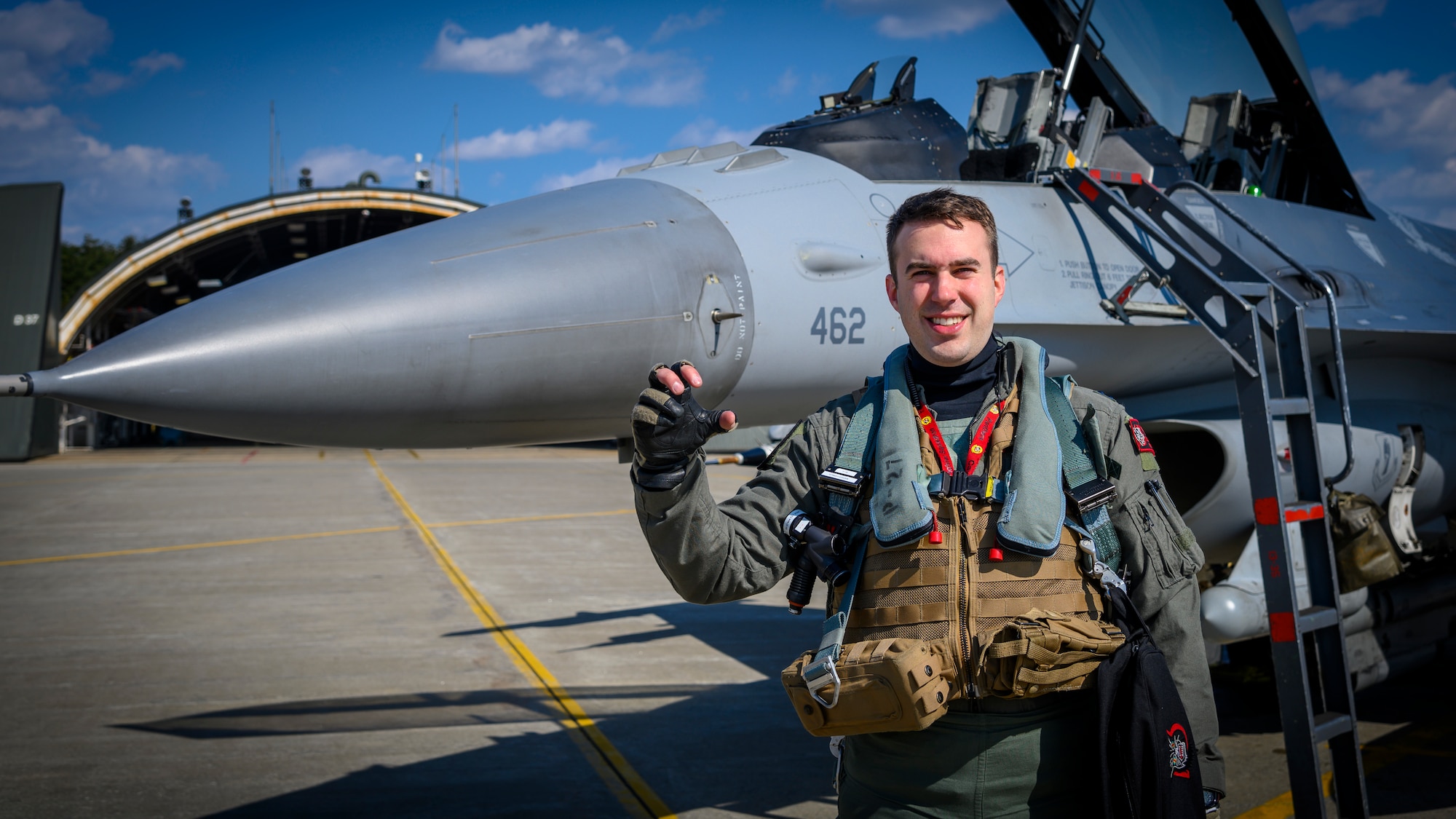 U.S. Air Force Capt. Spencer “Boca” Rhoton, a 13th Fighter Squadron F-16 Fighting Falcon pilot, holds up the 13th FS call sign “Cave Putorium” (CP), while posing for a photo at Misawa Air Base, Japan, April 7, 2021. The JAAGA awards happen annually, honoring the top Japan Air Self-Defense Forces (JASDF) and U.S. Air Force (USAF) member who best contributes to building U.S.-Japan partnerships. (U.S. Air Force photo by Airman 1st Class China M. Shock)