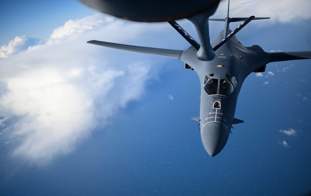 A U.S. Air Force B-1B Lancer aircraft assigned to the 7th Bomb Wing approaches a KC-135 Stratotanker aircraft assigned to the 100th Air Refueling Wing to receive fuel during a Bomber Task Force mission off the Scottish Coast, April 12, 2021. The U.S. routinely and visibly demonstrates commitment to allies and partners through the global employment of its military forces. (U.S. Air Force photo by Tech. Sgt. Emerson Nuñez)