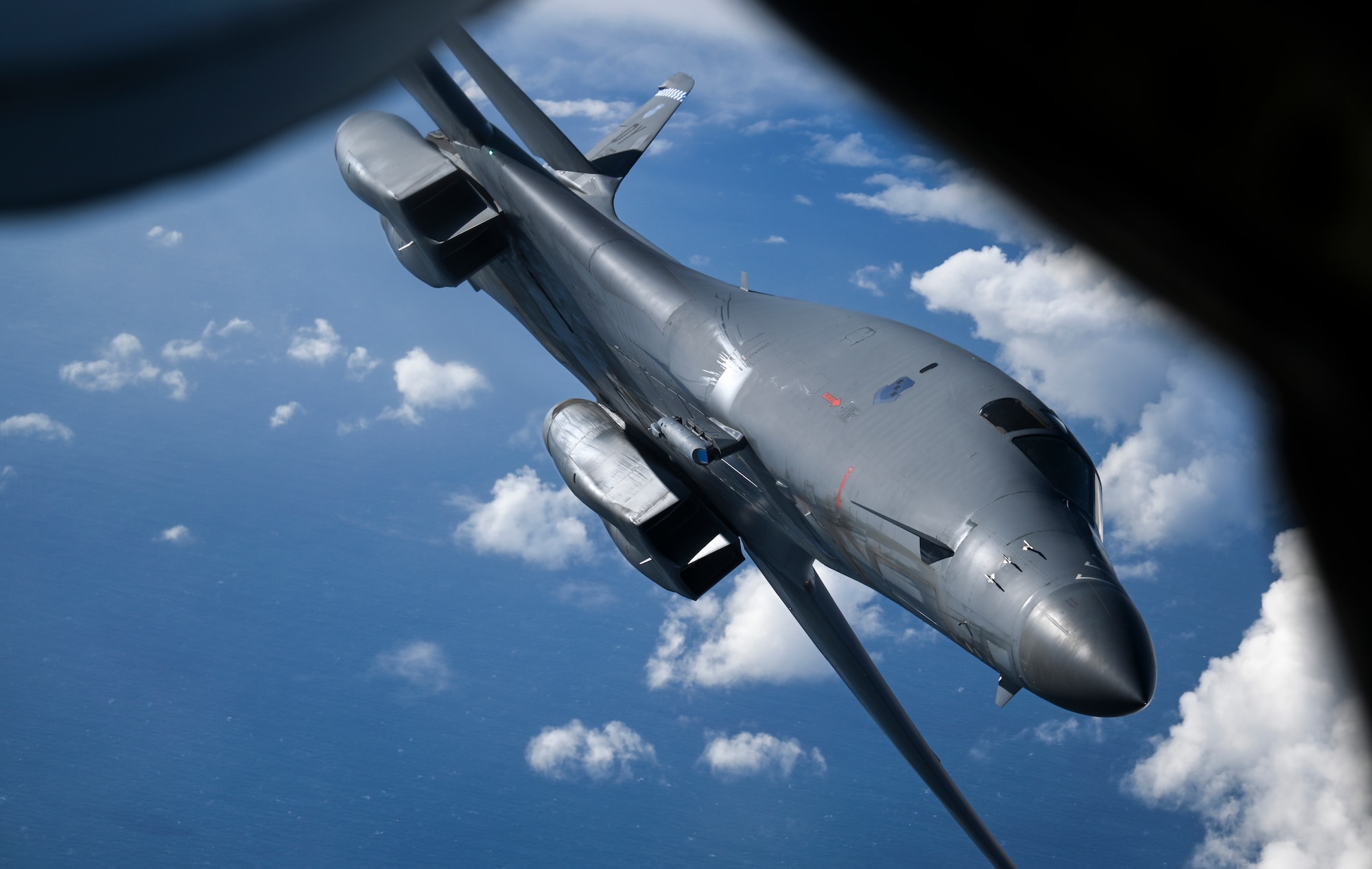 A U.S. Air Force B-1B Lancer aircraft assigned to the 7th Bomb Wing departs from a KC-135 Stratotanker aircraft assigned to the 100th Air Refueling Wing after receiving fuel during a Bomber Task Force mission off the Scottish Coast, April 12, 2021. U.S. bomber aircraft contribute to European regional security with the support of U.S. Air Forces in Europe and Air Forces Africa’s only permanent air refueling wing. (U.S. Air Force photo by Tech. Sgt. Emerson Nuñez)