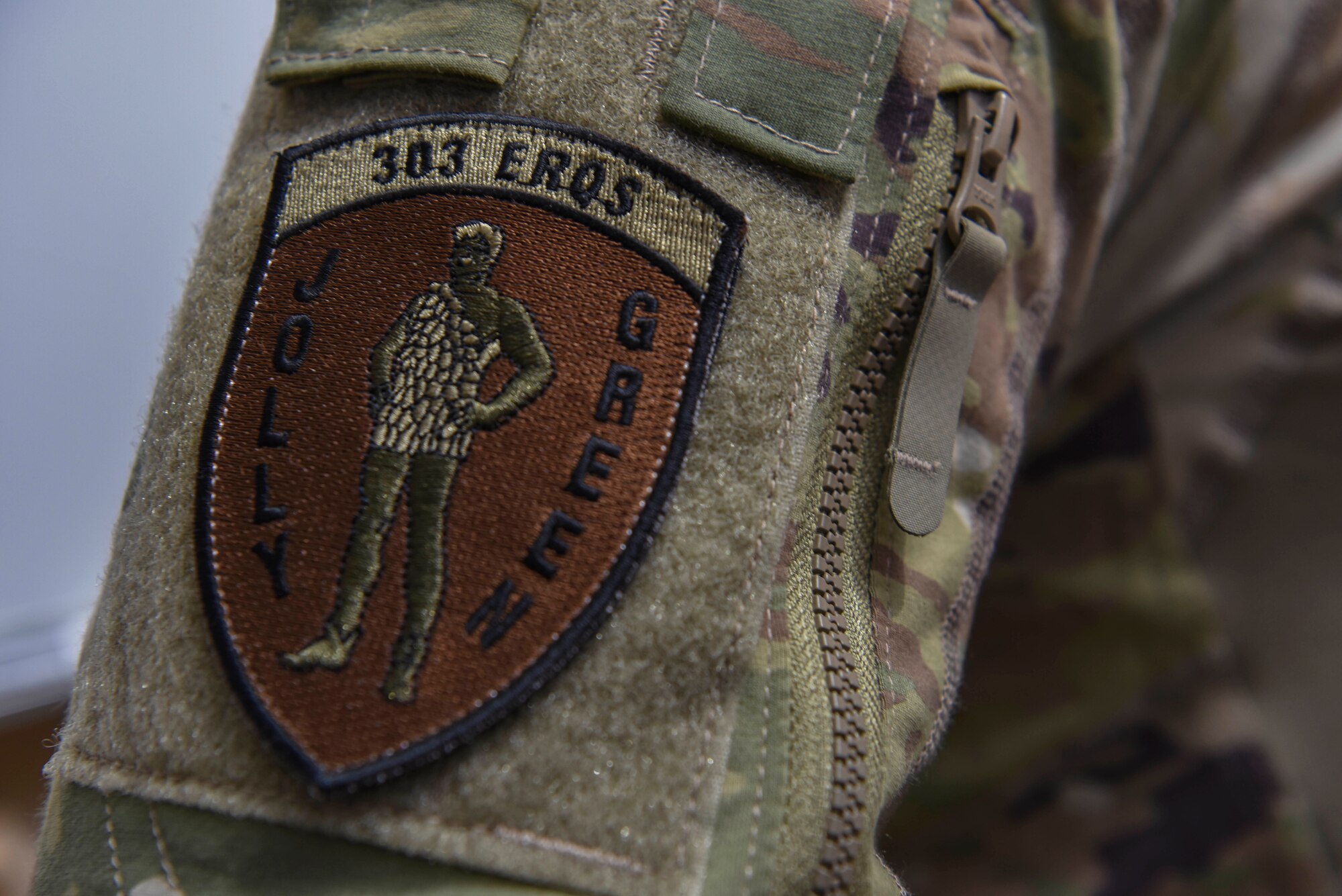 A 303rd Expeditionary Rescue Square patch sits on the arm of a service member at Camp Simba, Kenya, March 24, 2021.