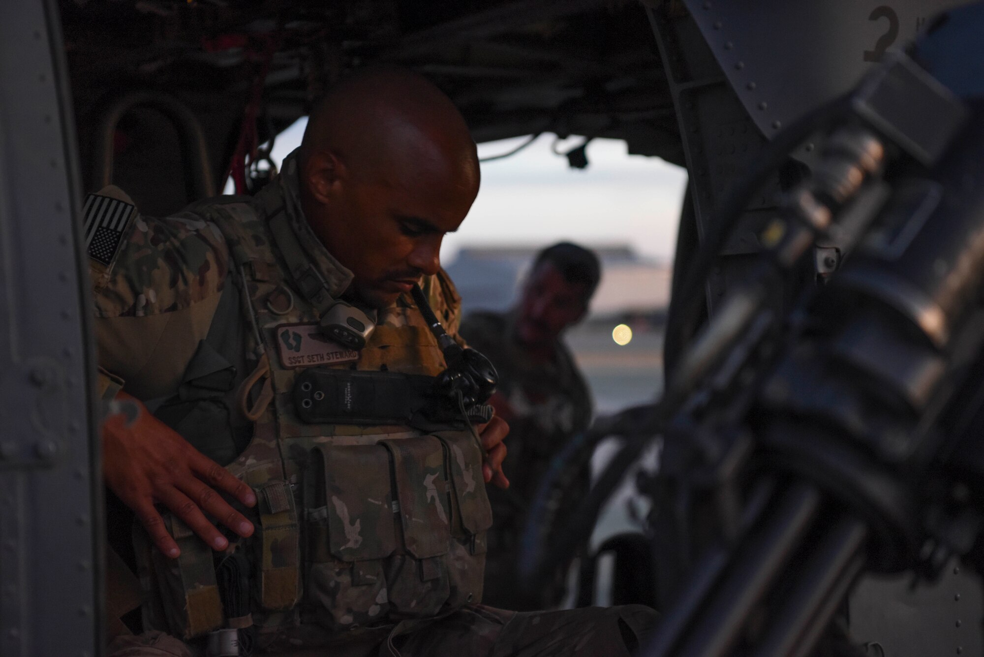 U.S. Air Force Staff Sgt. Seth Steward, 303rd Expeditionary Rescue Squadron special mission aviator, checks his harness prior to an exercise at Camp Simba, Kenya, March 24, 2021.