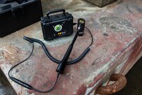 The prototype known as the Hammer Activated Measurement System for Testing and Evaluating Rubber, or HAMSTER for short, was jointly produced by NSWCPD and a contractor to provide a more efficient and accurate reading to determine the bonding condition of the hull of the vessel.