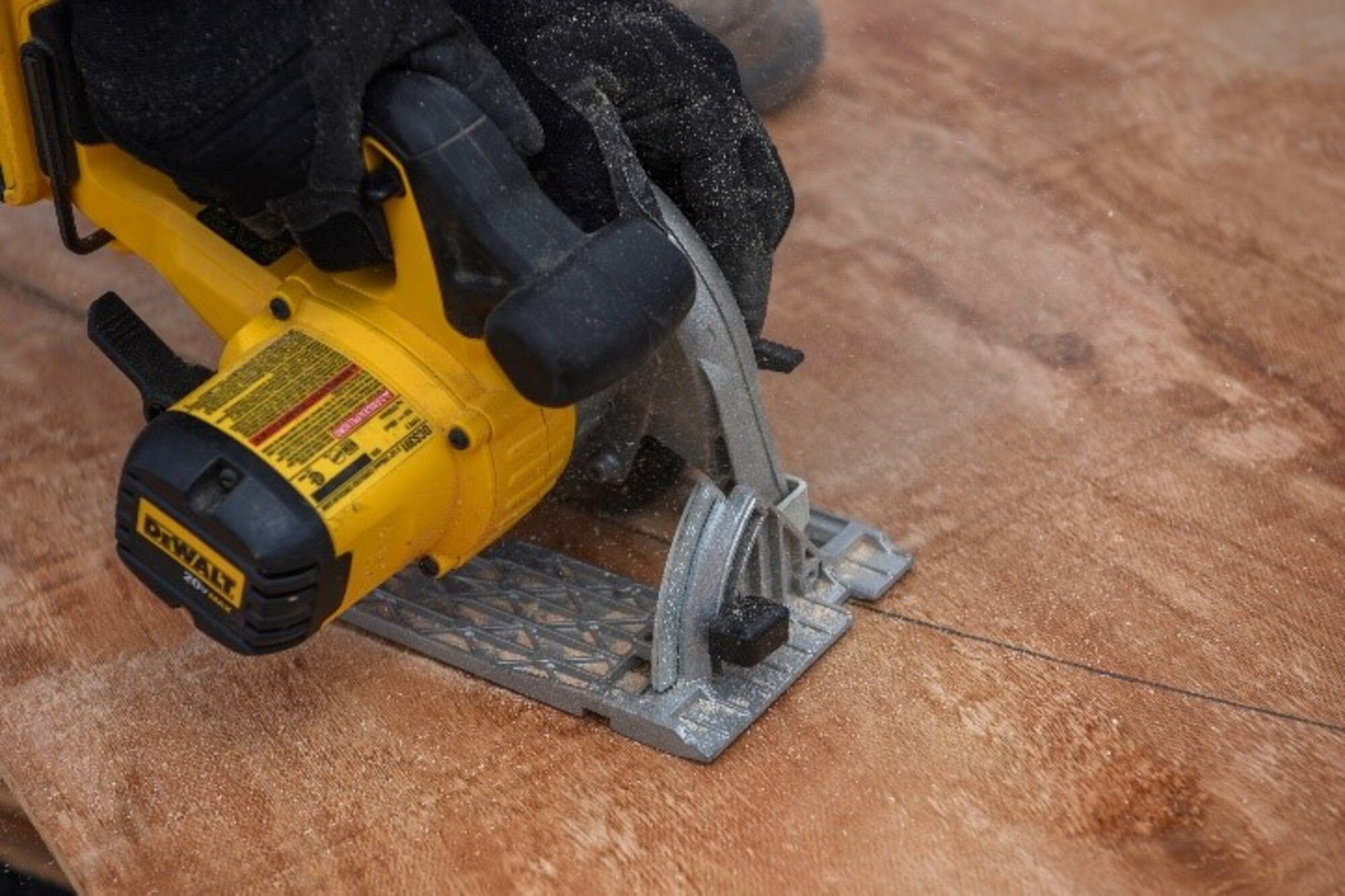 A cordless circular saw cuts through a wall template March 23, 2021, at Manda Bay, Kenya. The Airmen of the 786th CES deployed to Camp Simba to help maintain and improve structures around base, as well as help improve quality of life by building barriers and providing more water supplies for the camp.