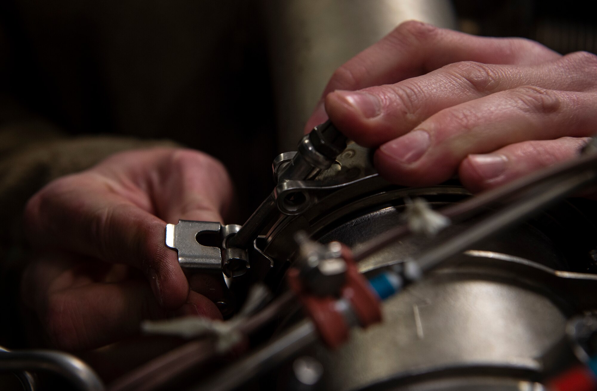 U.S. Air Force Senior Airman Zachary Stoehr, 62nd Maintenance Squadron Aerospace Ground Equipment Flight journeyman, performs maintenance to the butterfly valve of a piece of equipment that helps C-17 Globemaster IIIs start engines at Joint Base Lewis-McChord, Washington, April 7, 2021. The AGE flight is in charge of more than 390 pieces of equipment worth $13.9 million. (U.S. Air Force photo by Senior Airman Tryphena Mayhugh)