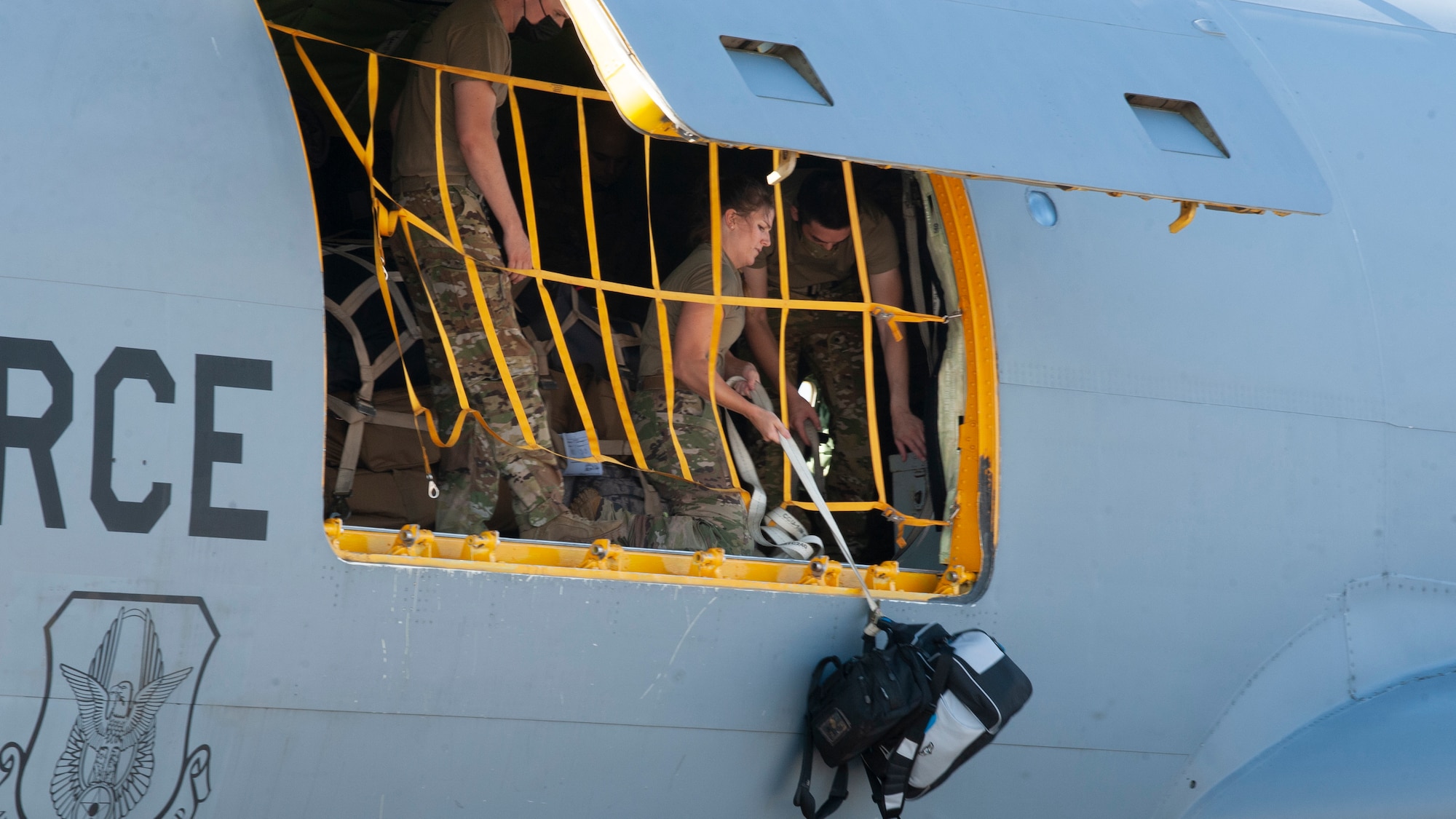 Team MacDill Airmen load cargo onto a KC-135 Stratotanker aircraft on the flight line, April 8, 2021 at MacDill Air Force Base, Fla.