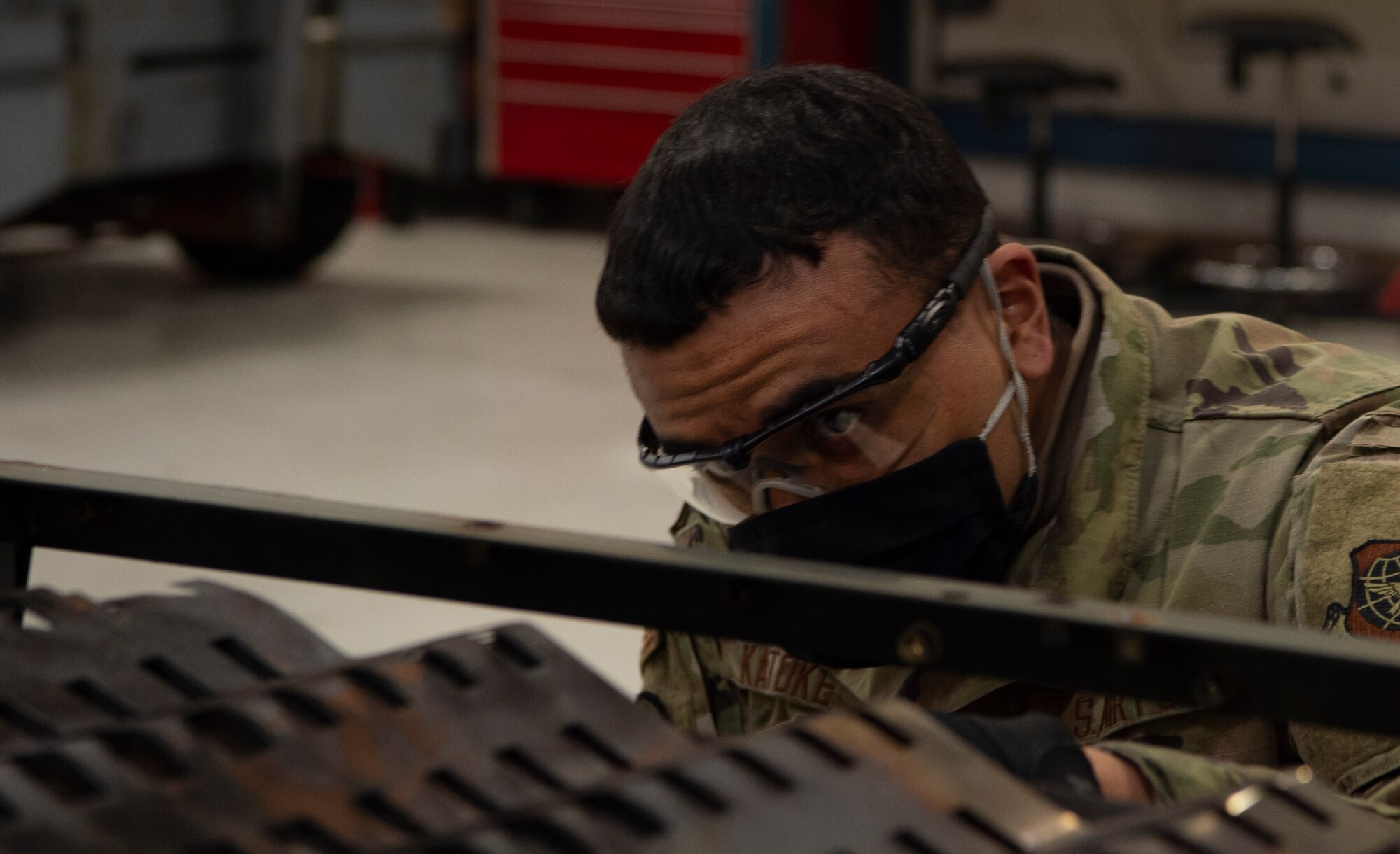 U.S. Air Force Airman Anthony Katoke, 62nd Maintenance Squadron Aerospace Ground Equipment Flight apprentice, cleans out a generator heater during a combustion section inspection at Joint Base Lewis-McChord, Washington, April 7, 2021. The 62nd MXS AGE shop focuses on preventative maintenance for equipment going to the flightline to assist with inspecting or repairing aircraft. (U.S. Air Force photo by Senior Airman Tryphena Mayhugh)