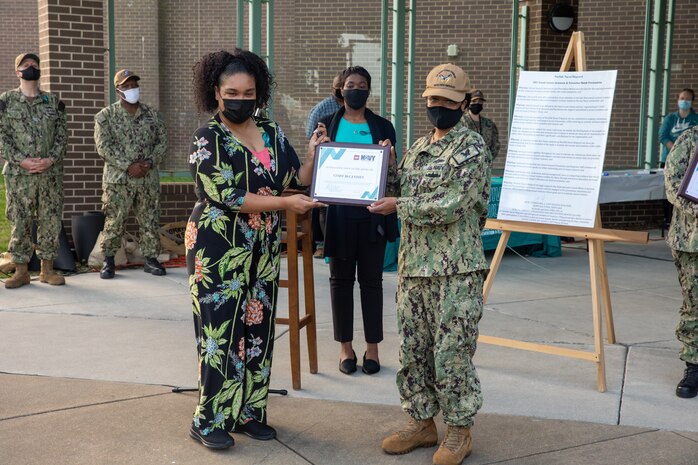 Four Sexual Assault Prevention and Response (SAPR) Victim Advocates (VAs) were selected as SAPR representatives of the year. Here, IT1 Cindy McCandies from Fleet Cyber Command receives an award from Norfolk Naval Shipyard's (NNSY) Sexual Assault Response Coordinator (SARC) Shalise Bates-Pratt and Federal Women’s Program (FWP) president Aiya Williams.