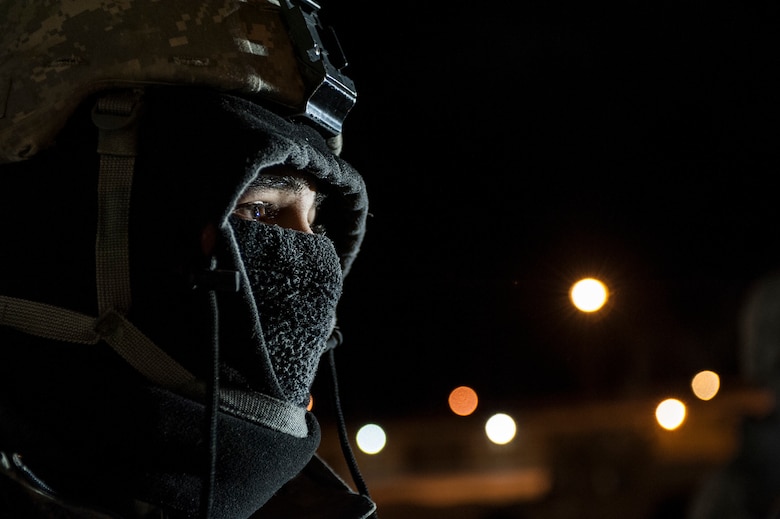 A member of the 5th Security Forces Squadron Delta Flight, awaits further instructions during a recapture exercise in the Weapons Storage Area at Minot Air Force Base, N.D. Jan. 30. Airmen in the area respondto a simulated security incident at a structure in the WSA with their fellow 5th SFS defenders to hone their skills in regards to recapture procedures. (U.S. Air Force photo/Senior Airman Stephanie Sauberan)