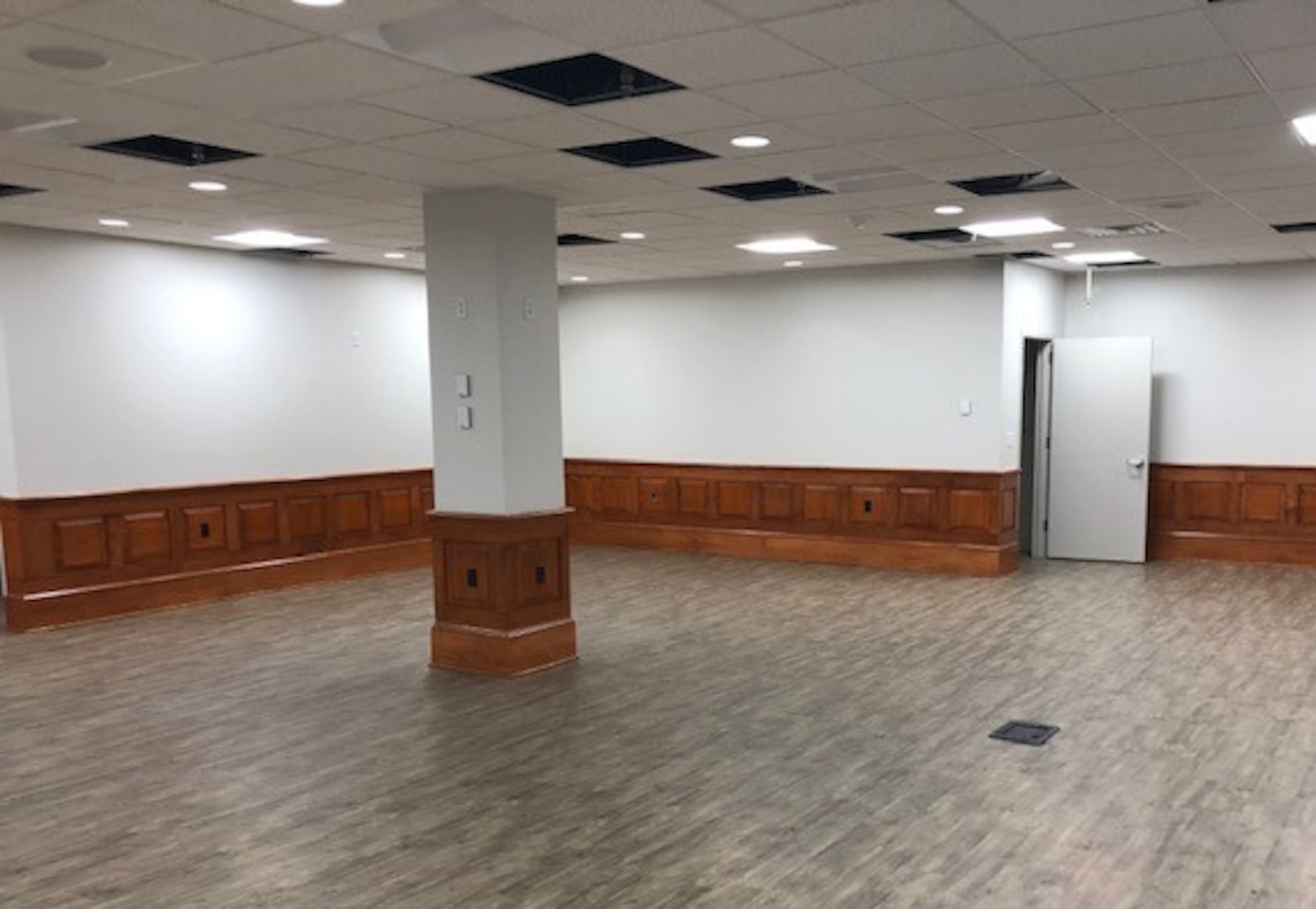 IMAGE: Building 1490’s first floor conference room now includes an AV and storage area. Before the demolition and new construction, two conference rooms populated the area; now, the area houses one large conference room with the storage area.