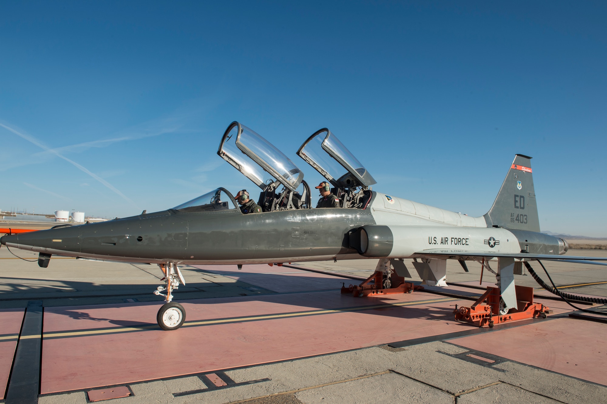 U.S. Air Force Test Pilot School students Capt. Mattia Nucciarelli, from the Italian Air Force, and Maj. Jeremy Jiang, from the Republic of Singapore Air Force, prepare to conduct a data collection test run at the Installed Engine Test Facility Horizontal Thrust Stand at Edwards Air Force Base, California, March 5. The thrust stand was installed in 1955 and has hosted dozens of different airframes throughout the years. (Air Force photo by Joshua Miller)