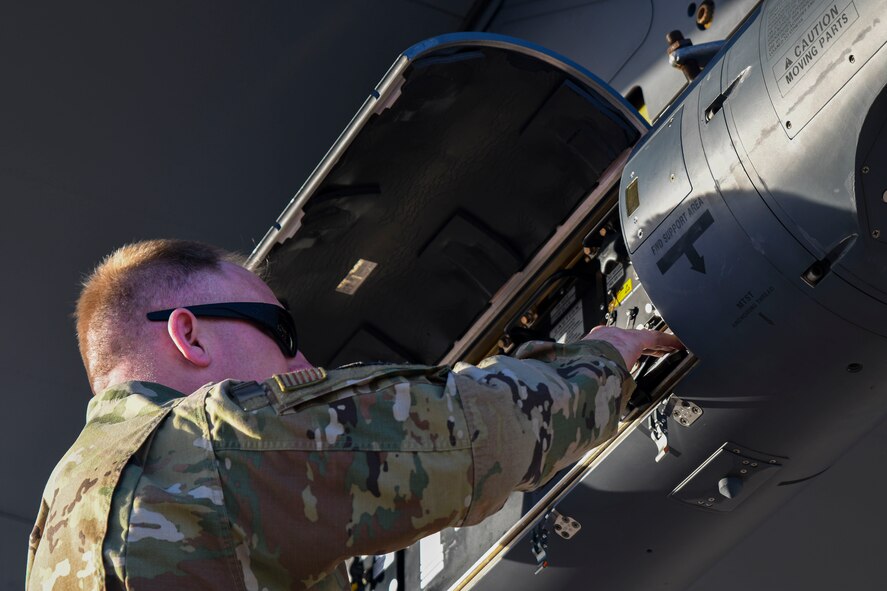 A photo of a maintainer working on an airplane