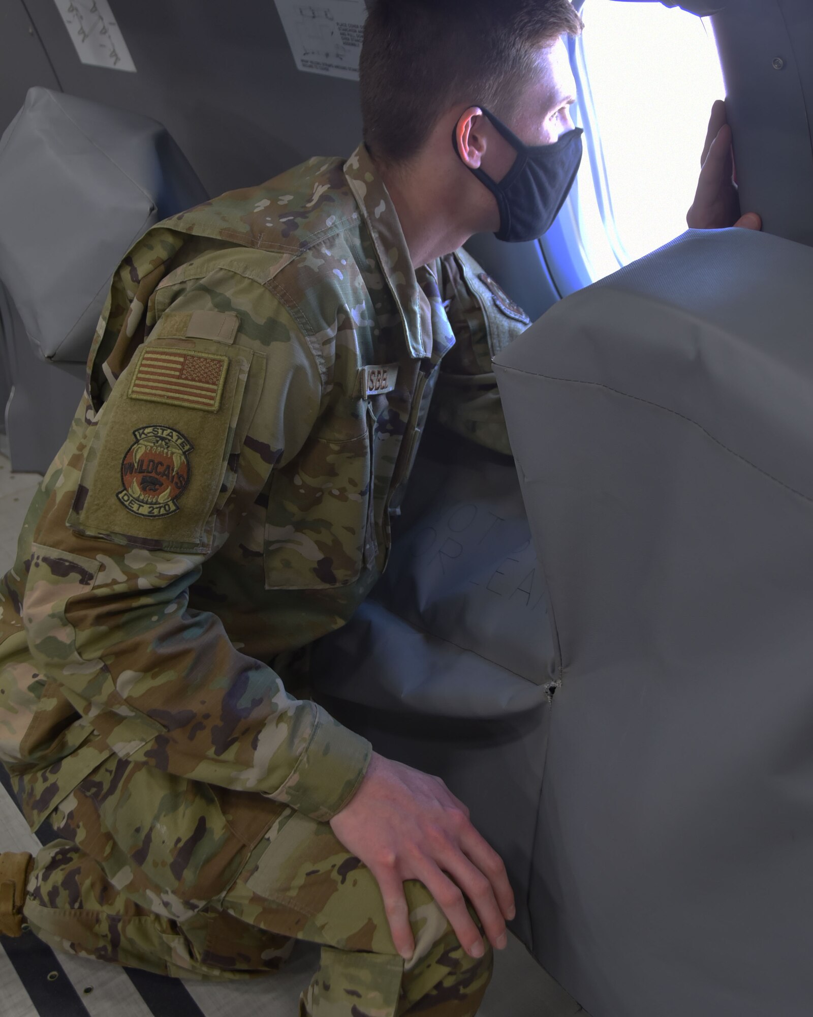 Riley Isbel, Air Force Reserve Officers’ Training Detachment 270 at Kansas State University cadet, looks out the window of a KC-46A Pegasus assigned to McConnell Air Force Base, Kan., April 10, 2021. Isbel was part of a tour that included 25 recruiters from the 507th Air Refueling Wing, 352nd Recruiting Squadron, and five cadets from Detachment 270. They flew on two KC-46A Pegasus air refueling missions during the April Unit Training Assembly. The flights were part of a three-day tour of the 931st Air Refueling Wing, to display to the recruiters and cadets the full-range of the Reserve mission at Team McConnell.