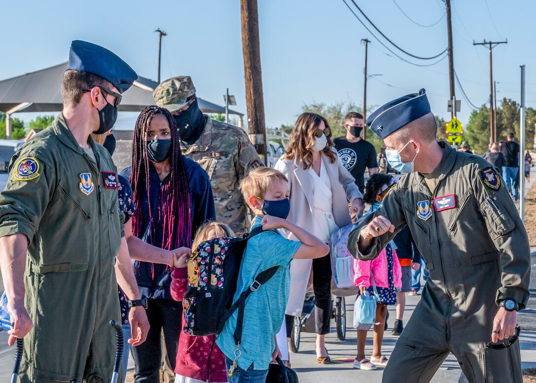 Brig. Gen. Matthew Higer, 412th Test Wing Commander, greets students and their family during the first day of physical in-person learning and grand reopening of Bailey Elementary School on Edwards Air Force Base, California, April 12. (Air Force photo by Giancarlo Casem)