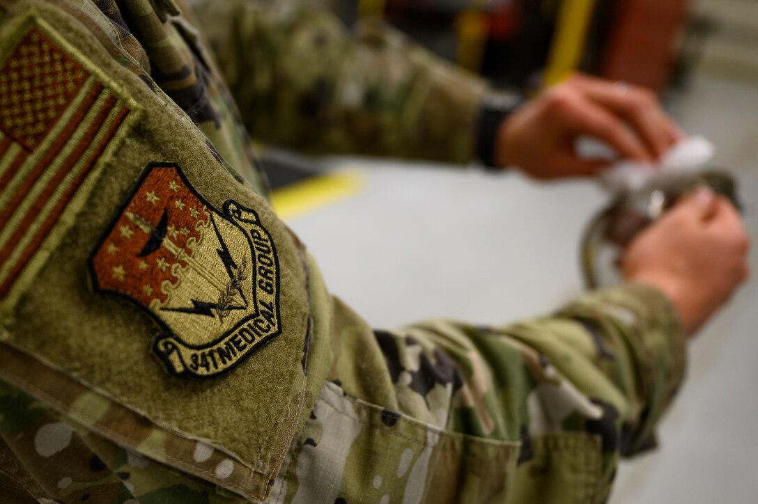Senior Airman Lee Williams, 341st Operational Medical Readiness Squadron bioenvironmental engineer technician, cleans a pair of protective eyewear April 5, 2021, at Malmstrom Air Force Base, Mont.