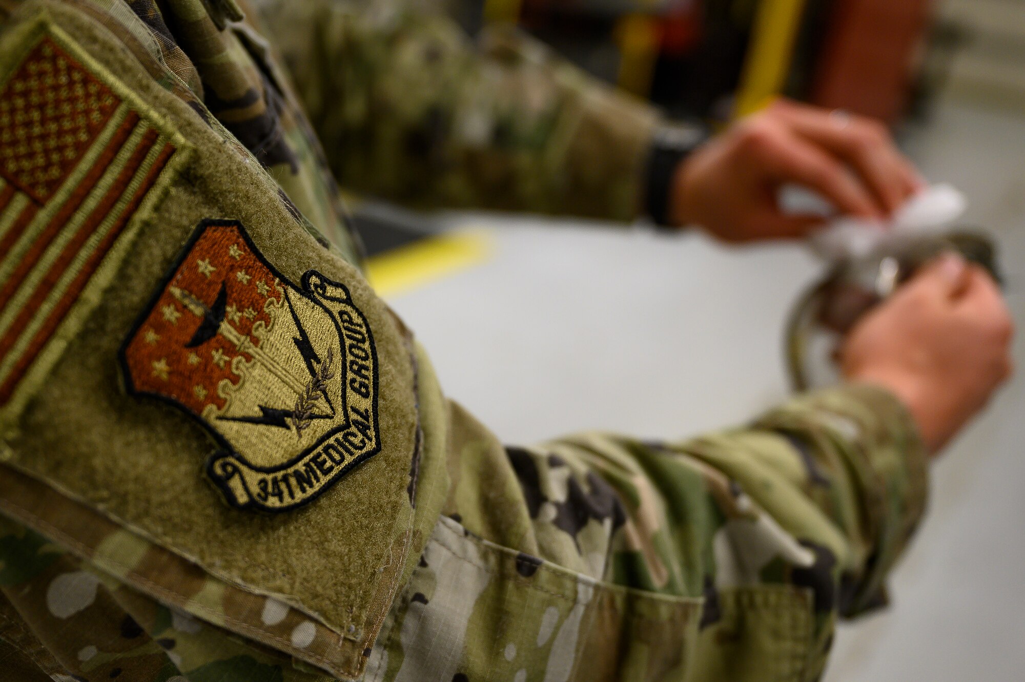 Senior Airman Lee Williams, 341st Operational Medical Readiness Squadron bioenvironmental engineer technician, cleans a pair of protective eyewear April 5, 2021, at Malmstrom Air Force Base, Mont.