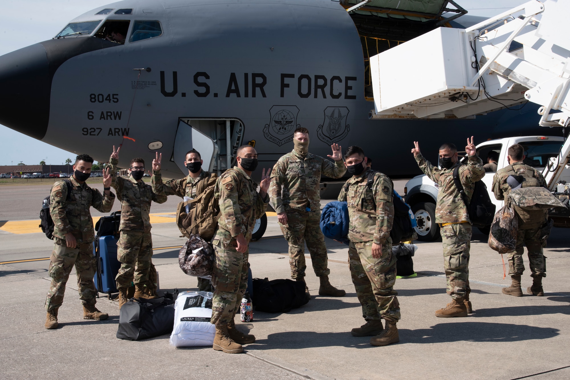 Team MacDill Airmen pose for a photo outside a KC-135 Stratotanker aircraft on the flight line, April 8, 2021 at MacDill Air Force Base, Fla.