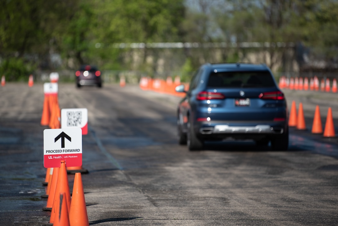 Cars navigate a labyrinth of traffic cones of their way to Kentucky’s largest drive-through COVID-19 vaccination clinic at Cardinal Stadium in Louisville, Ky., April 12, 2021. The clinic, which will be open seven weeks, can vaccinate up to 4,000 patients a day. (U.S. Air National Guard photo by Dale Greer)