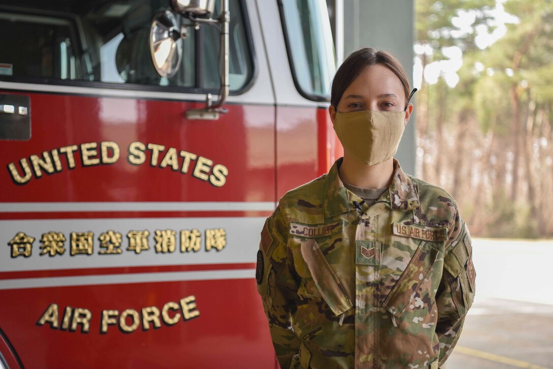 U.S. Air Force Staff Sgt. Journey Collier, a 35th Civil Engineer Squadron firefighter, stands in front of a fire truck at Misawa Air Base, Japan, March 31, 2021. Collier recently won the Air Force Military Firefighter of the Year award and is now representing the Air Force at the Department of Defense level. (U.S. Air Force photo by Airman 1st Class Joao Marcus Costa)