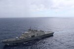 USS Wichita (LCS 13) fires at the floating training target during the bi-lateral live fire exercise with the Jamaica Defense Force Coast Guard patrol vessel HMJS Cornwall, April 9, 202