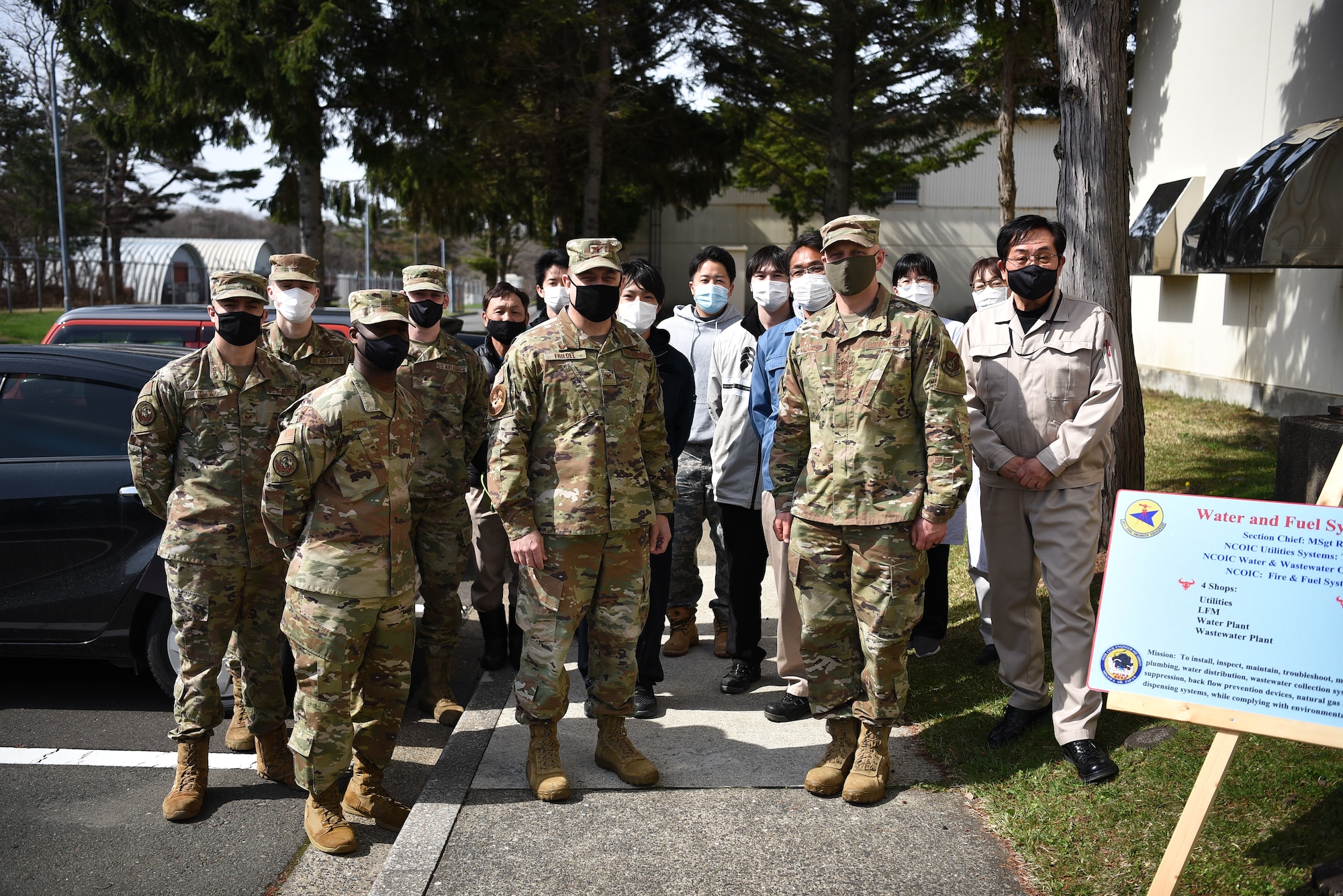 Group of military members pose for photo