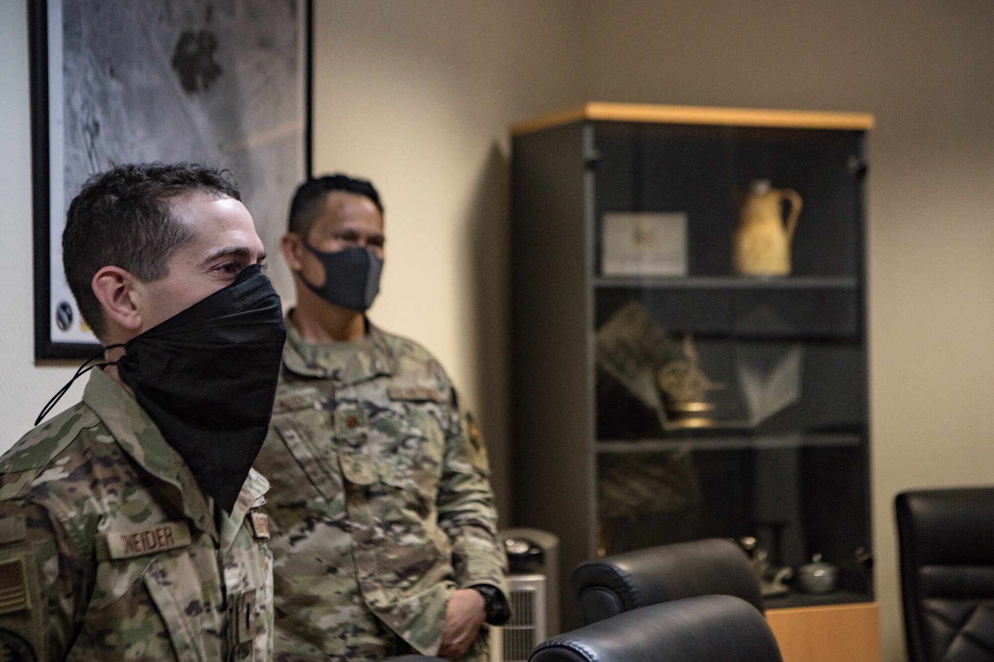 two men attend a meeting