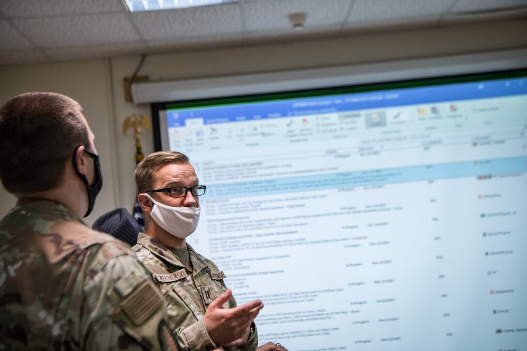 a man speaks during a meeting