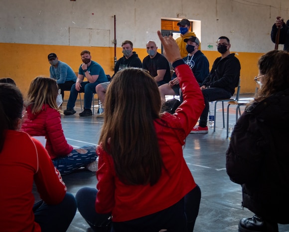 210304-N-VH871-1536 SIGONELLA, Italy (March 4, 2021) Sailors assigned to the "Grey Knights" of Patrol Squadron (VP) 46, assist Italian middle schoolers with their English proficiency as part of a community relations project, March 4, 2021. VP-46 is currently forward-deployed to the U.S. Sixth Fleet area of operations and is assigned to Commander, Task Force 67, responsible for tactical control of deployed maritime patrol and reconnaissance squadrons throughout Europe and Africa. U.S. Sixth Fleet, headquartered in Naples, Italy, conducts a full spectrum of joint and naval operations, often in concert with allied and interagency partners, in order to advance U.S. national security interests and stability in Europe and Africa. (U.S. Navy photo by Mass Communication Specialist 2nd Class Austin Ingram/ Released)