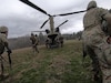 Soldiers from Bravo Company, 1st Battalion, 109th Infantry Regiment, deploy from a CH-47 Chinook during aerial movement training on April 9, 2021. (U.S. Army Photo by Sgt. 1st Class Matthew Keeler)