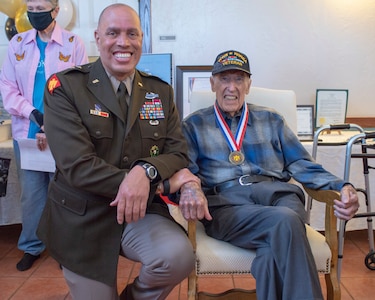 Maj. Gen. Michael Thompson, adjutant general for Oklahoma, poses with Lt. Col. (Ret.) Oren L. Peters, World War II and Korean War Veteran from the renowned 45th Infantry Division, Saturday, April 10, 2021, during a Thunderbird Medal presentation ceremony. The Thunderbird Medal is the Oklahoma National Guard’s highest award presented to a civilian and was presented to Peters for his distinguished military service. (Oklahoma National Guard photo by Lt. Col. Geoff Legler)